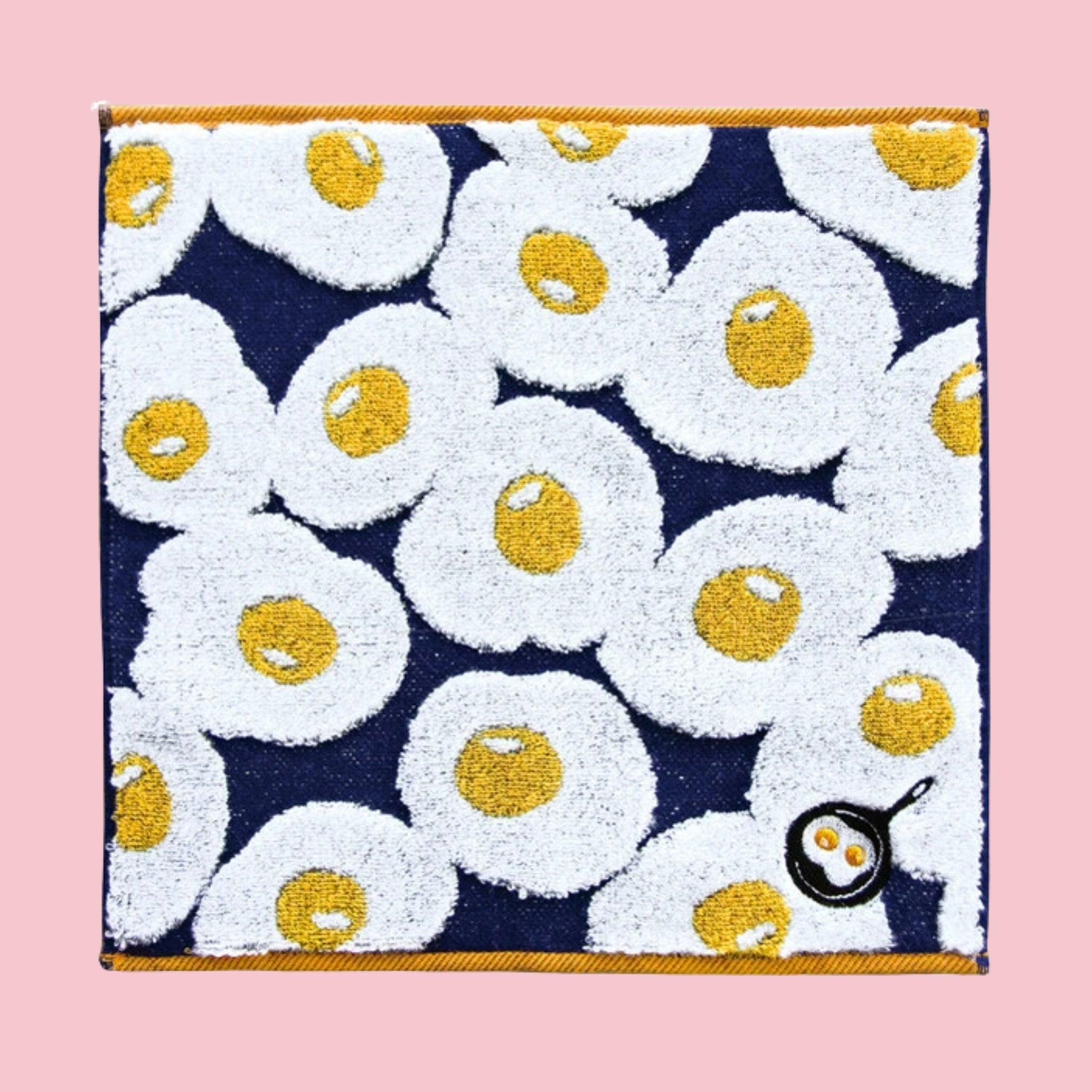 Imabari mini towel with fried egg print pattern on navy background, 23 x 23 cm, Made in Japan