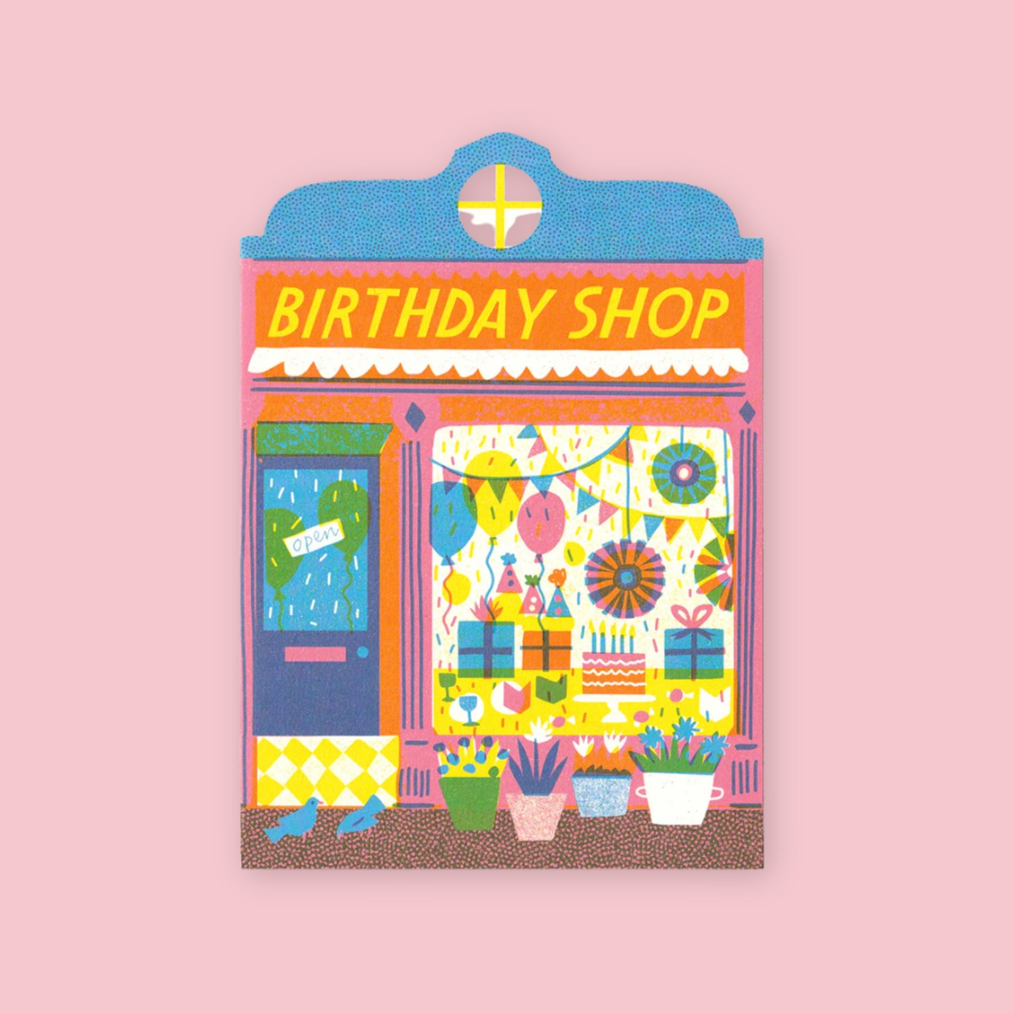 The Printed Peanut die cut greeting card shaped like a birthday shop storefront with balloons and festive decorations