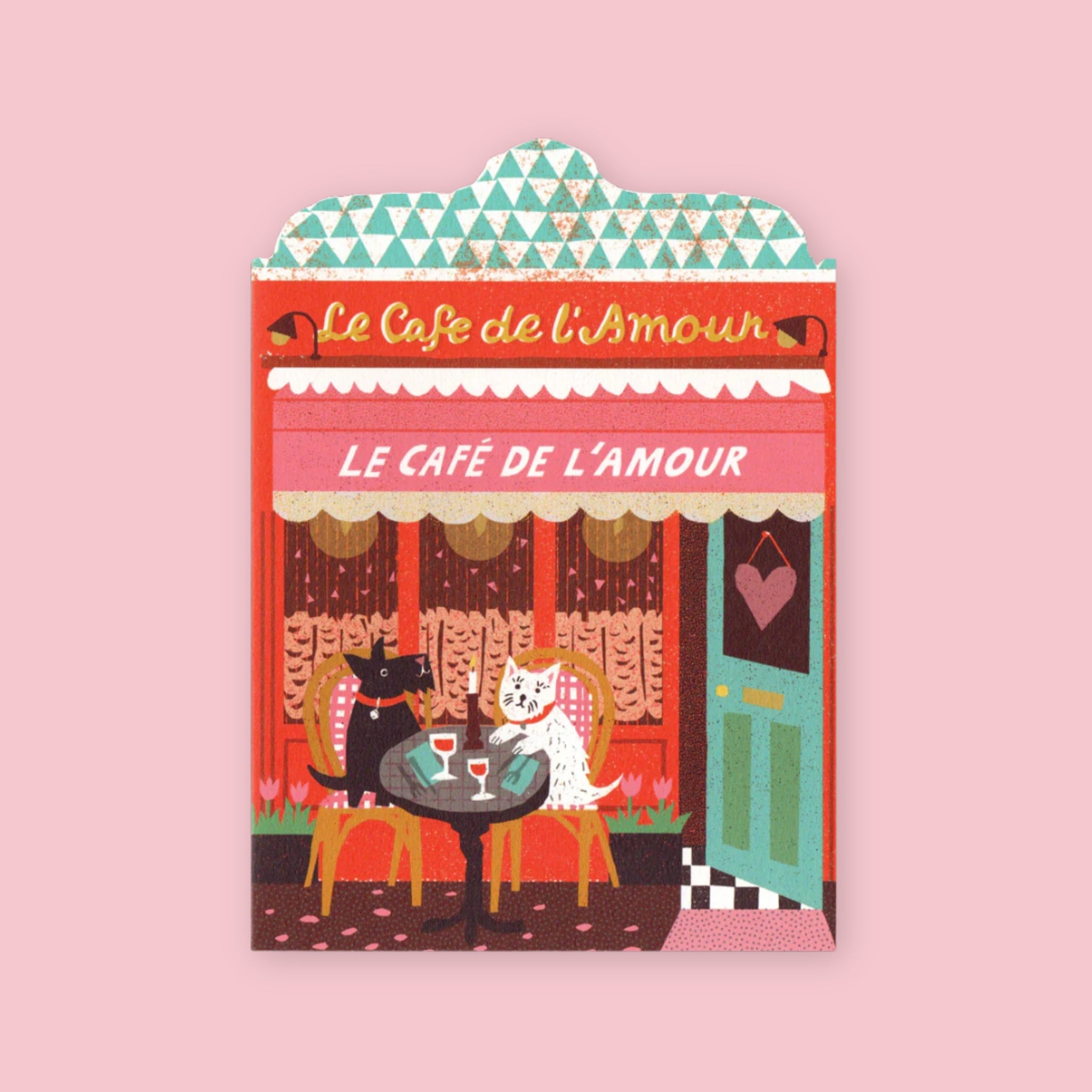 The Printed Peanut die cut greeting card shaped like a French café storefront with a dog couple dining and warm lighting