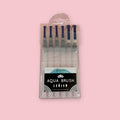 Set of 6 Aqua Watercolor Brushes in a package against a pink background