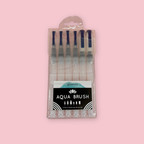 Set of 6 Aqua Watercolor Brushes in a package against a pink background
