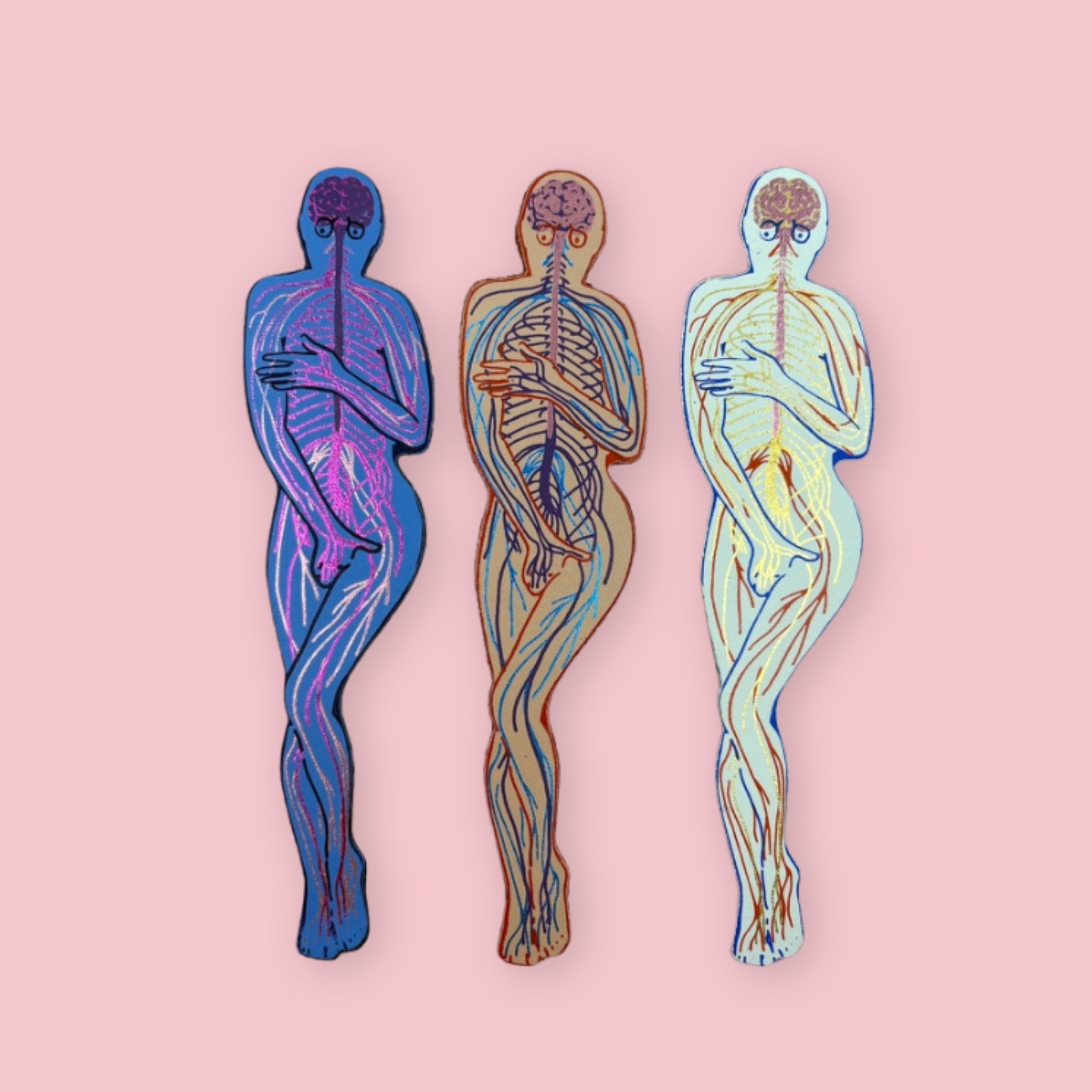 Three leather bookmarks featuring illustrated human nervous system anatomy in blue, blush, and cream designs on a pale pink background.