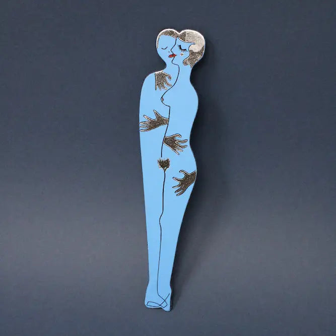 Blue Ark Colour Design book lover bookmark with an illustrated embracing couple on a dark blue background
