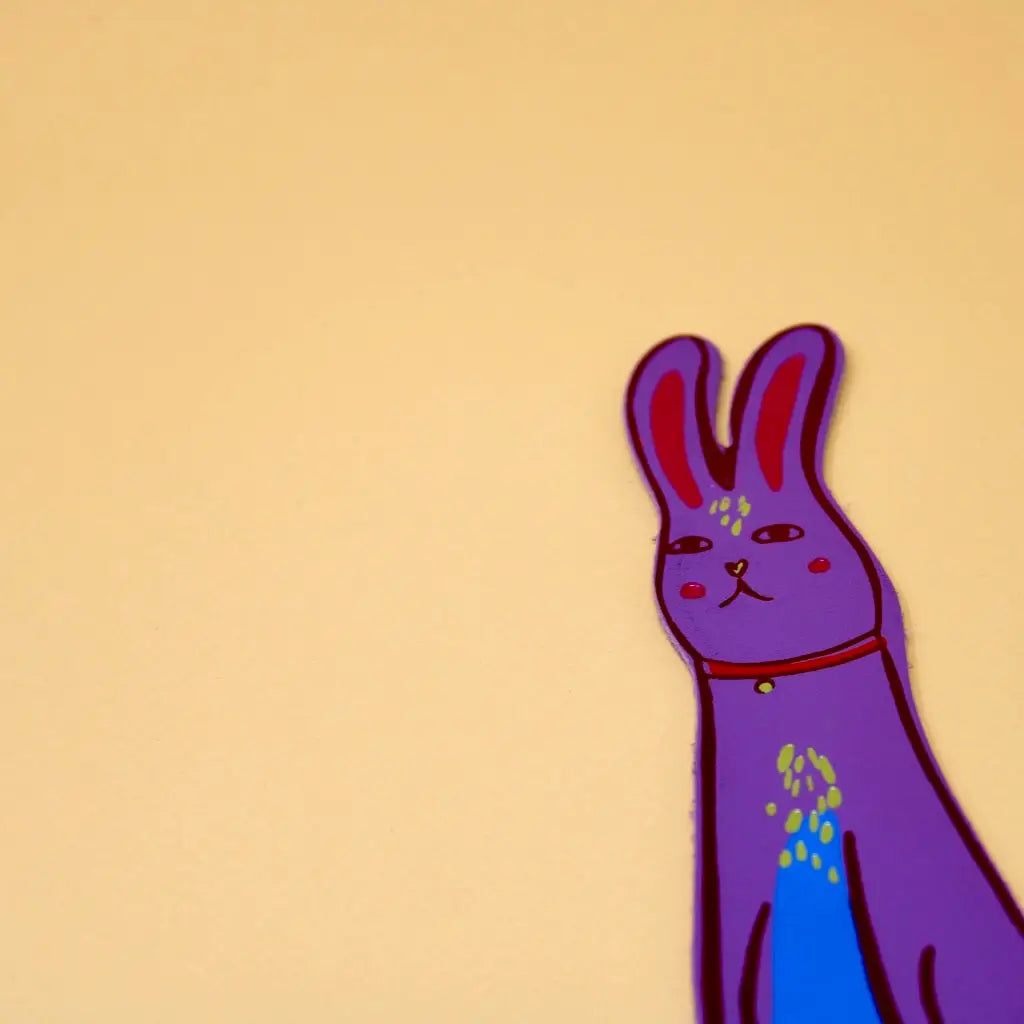 Lilac Ark Colour Design rabbit bookmark with illustrated bunny face on a beige background