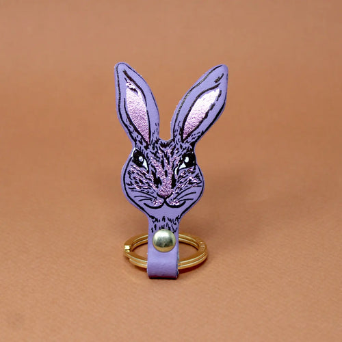 Ark Colour Design rabbit keychain in lilac with a gold ring and detailed rabbit face illustration.