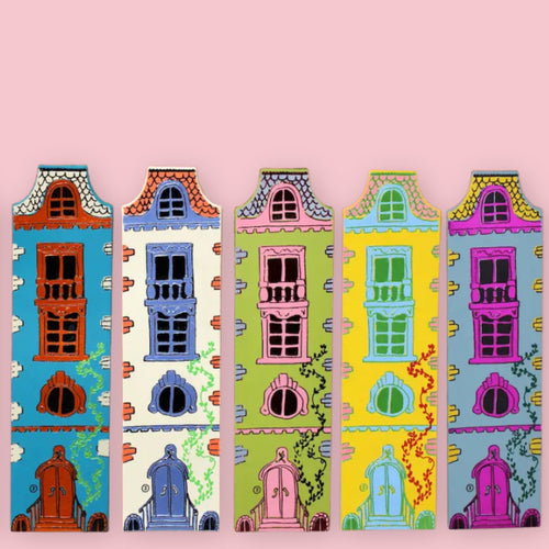 Five colorful Ark Colour Design  dollhouse-shaped bookmarks with illustrated doors and windows on a pink background