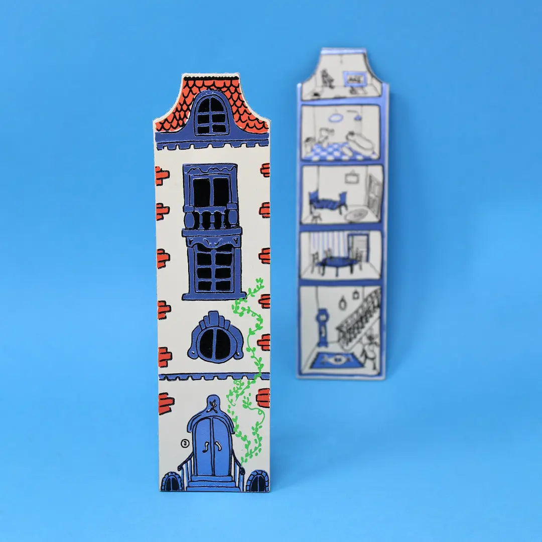 Ark Colour Design white dollhouse-shaped bookmarks with illustrated doors and windows on a beige background