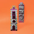 Ark Colour Design grey-blue dollhouse-shaped bookmarks with illustrated doors and windows on a beige background