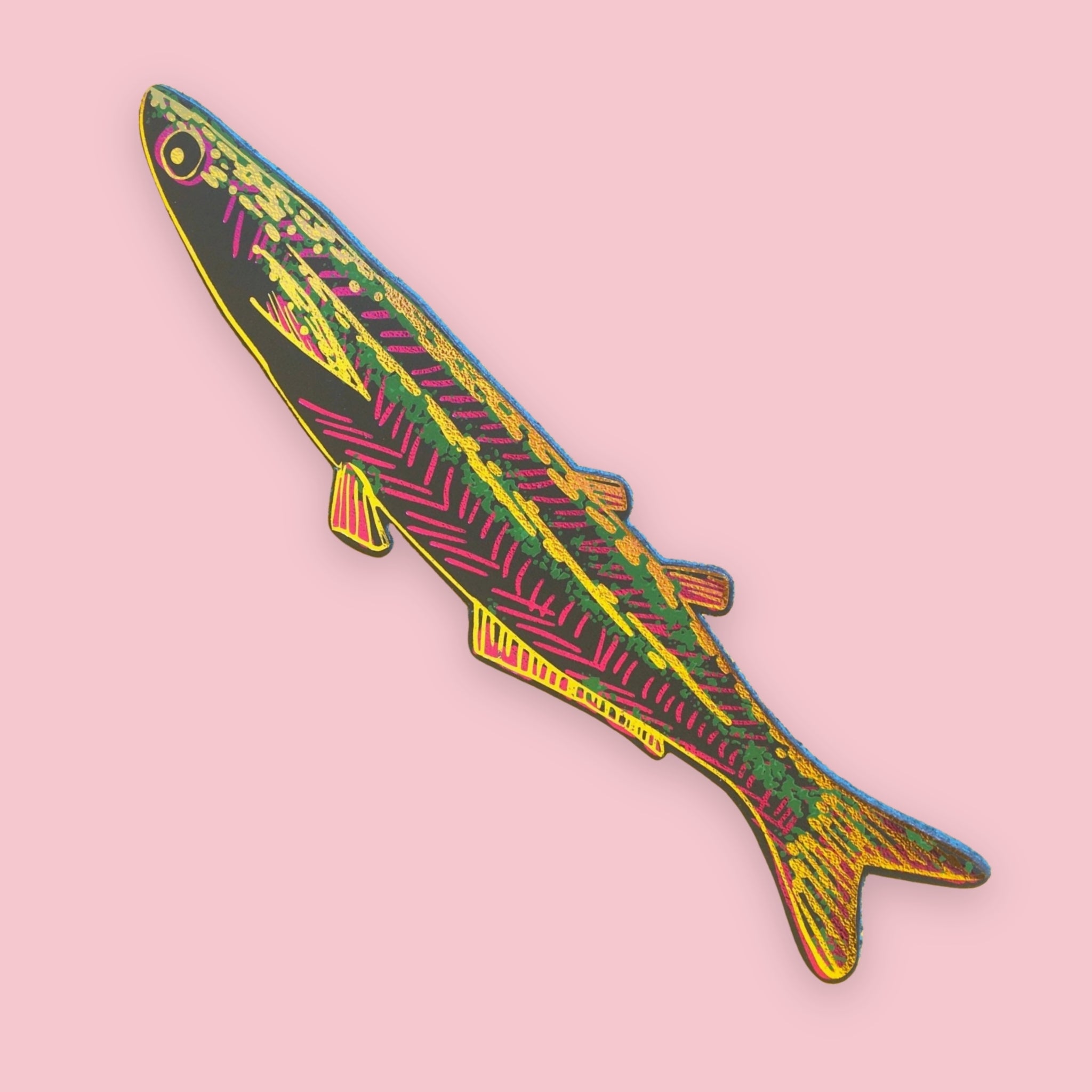 Dark green fish-shaped bookmark with gold, pink, and green patterned stripes, on a pink background.