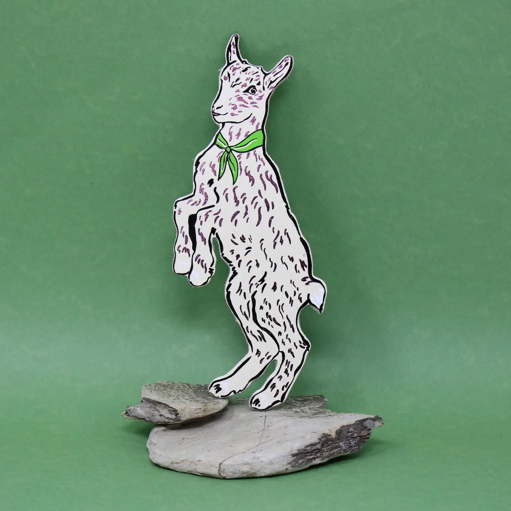Ark Colour Design white goat-shaped bookmark with a green neckerchief, standing on a green background