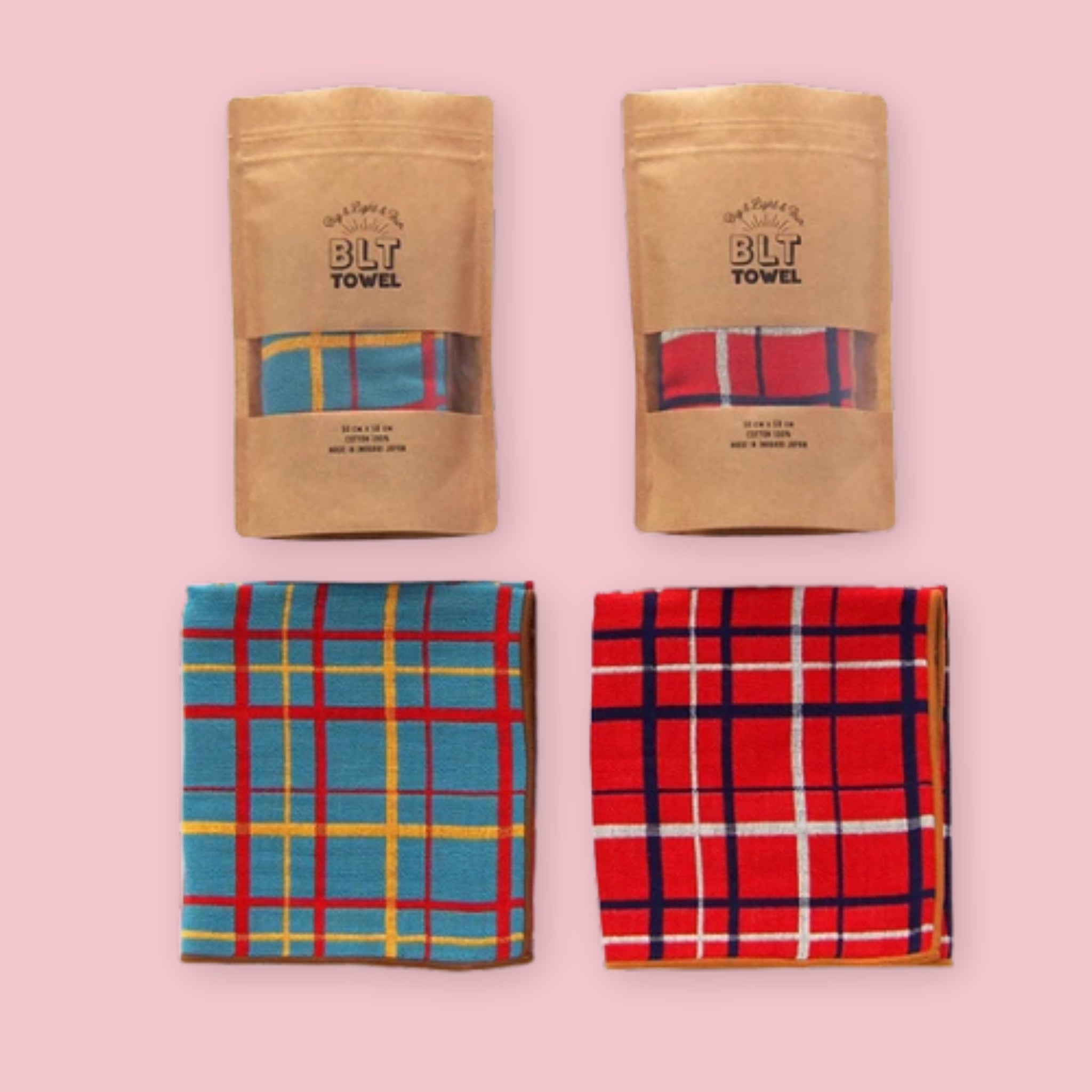 Imabari BLT Towel in Blue Plaid and Red Plaid styles, shown folded and in kraft paper packaging on a pink background