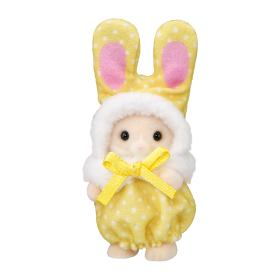 Calico Critters bunny figure  wearing a yellow polka-dot bunny outfit with pink inner ears, a white fluffy hood, and a yellow ribbon bow at the neck, shown on a plain white background.