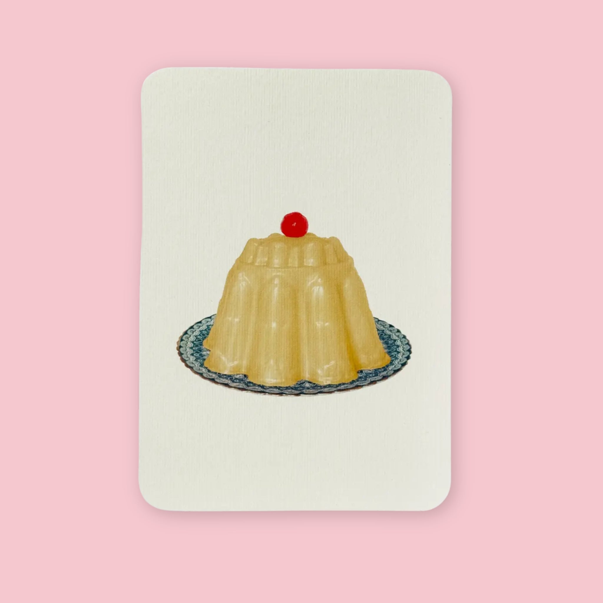 Canonbury Press Greeting card featuring an illustrated custard gelatin dessert topped with a red cherry on a blue patterned plate.