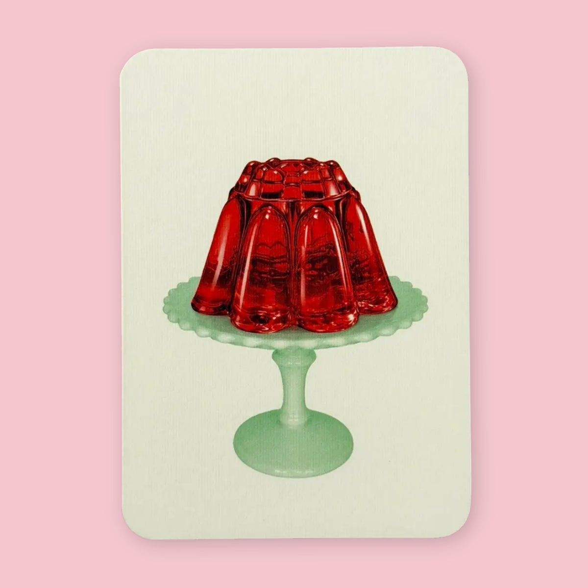 Canonbury Press greeting card featuring red jelly on a pale green pedestal plate against a pink background
