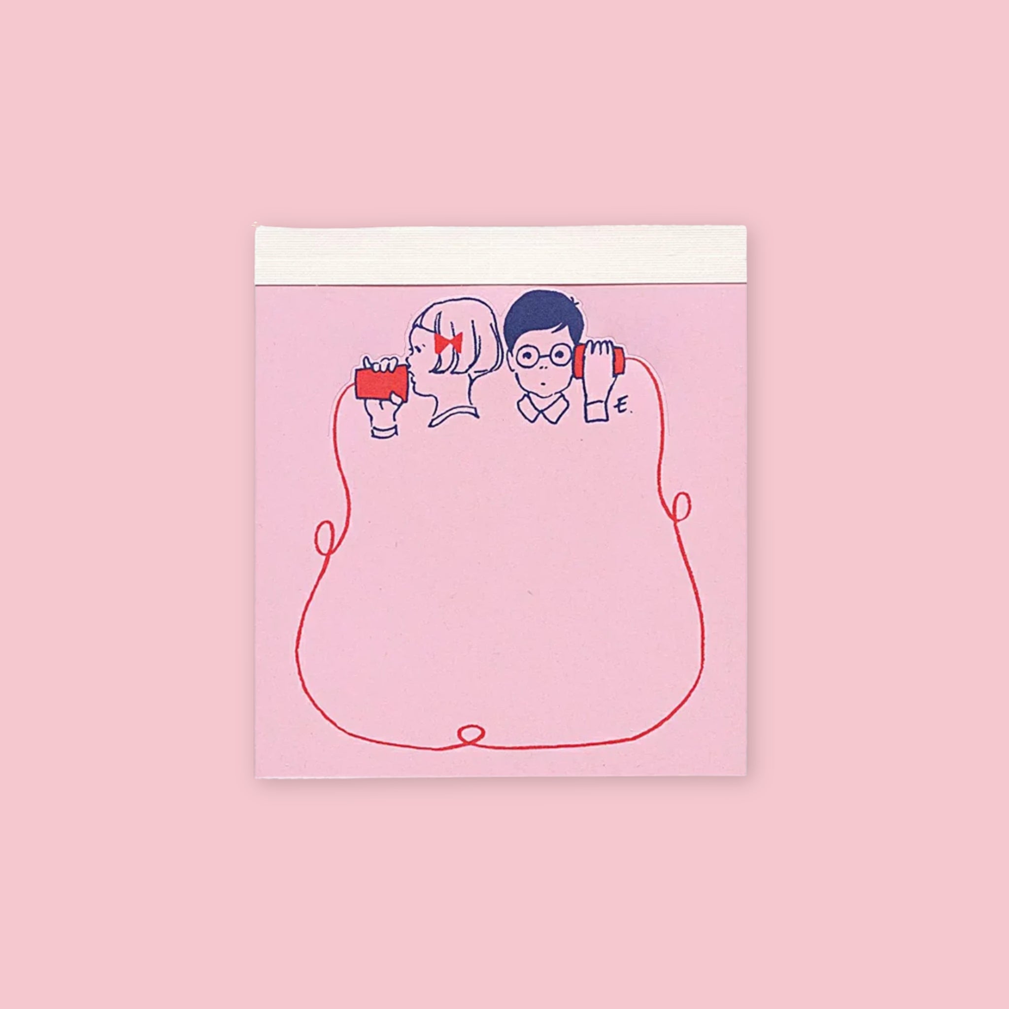 Die-cut memo pad featuring illustrated boy and girl sharing a red string on a pink background
