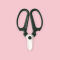 Hand Creation flower shears in moss green with white blade tip on a pink background