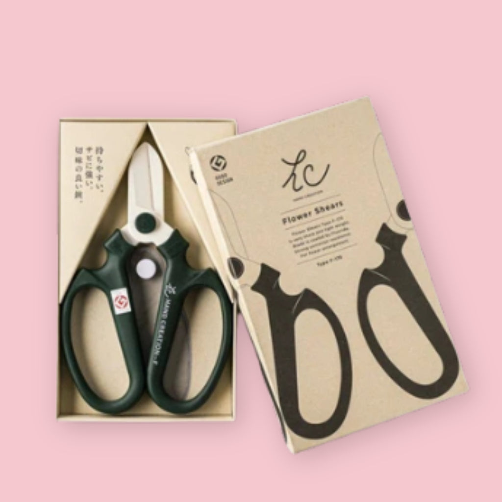 Hand Creation flower shears displayed with kraft box packaging on a pink background