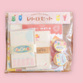Furukawashiko retro stationery set with assorted paper goods in clear packaging on a pink background