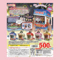 Japanese retail packaging for a 6-toys set by Toys Spirits, featuring miniature festival stall keychains in various colors, with a hand holding one of the blue and white stalls. The package has a pink border and detailed product photos, pricing, and Japanese text.