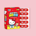 Hello Kitty Bandages box shown alongside a strip of individual red bandages printed with a Hello Kitty pattern, on a pink background.