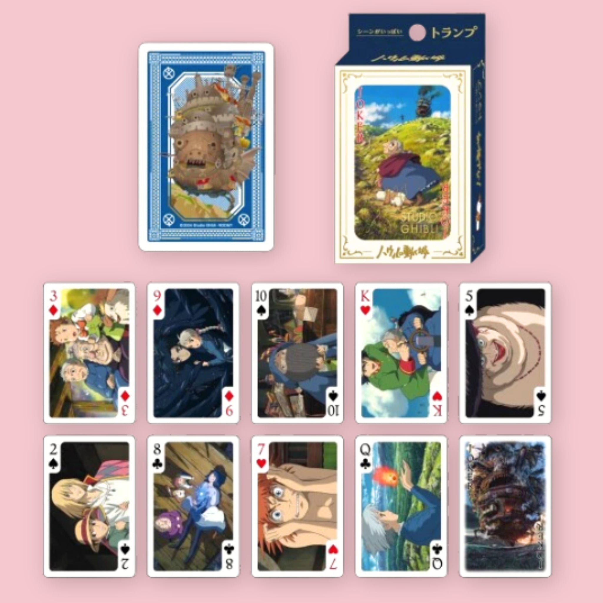 Studio Ghibli Howl's Moving Castle playing cards with card box and a card back design featuring the Moving Castle, shown alongside an assortment of face cards illustrated with scenes and characters from the film, against a pink background