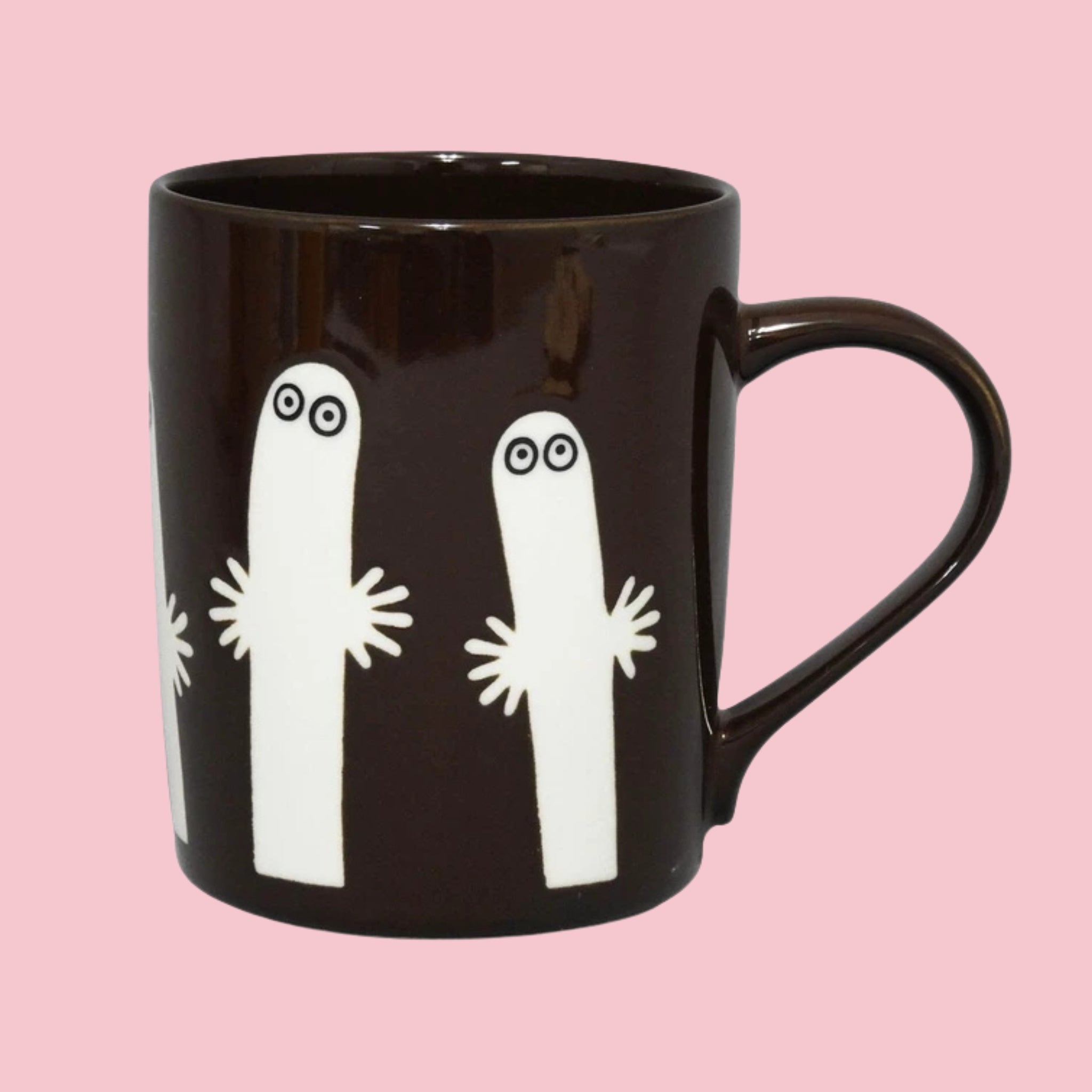 Dark brown Japanese Moomin mug with embossed Hattifatteners — the eerie, wandering creatures from Moomin Valley — on a pink background