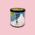 Jugetsudo Matcha Fuji no Ka tin with cherry blossom and Mt. Fuji illustration on a pink background