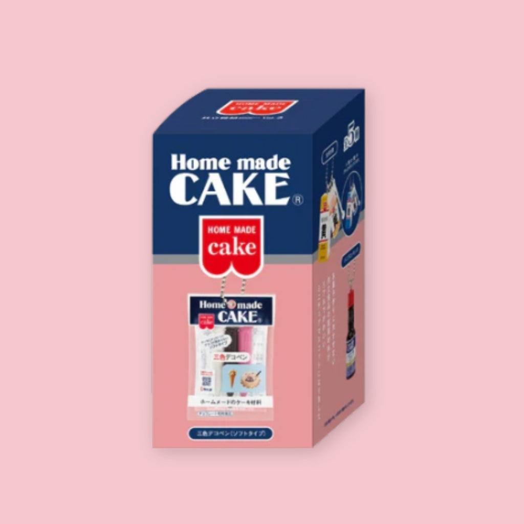 Home Made Cake miniature mascot blind box featuring a Japanese baking-supply charm, shown on a pink background.