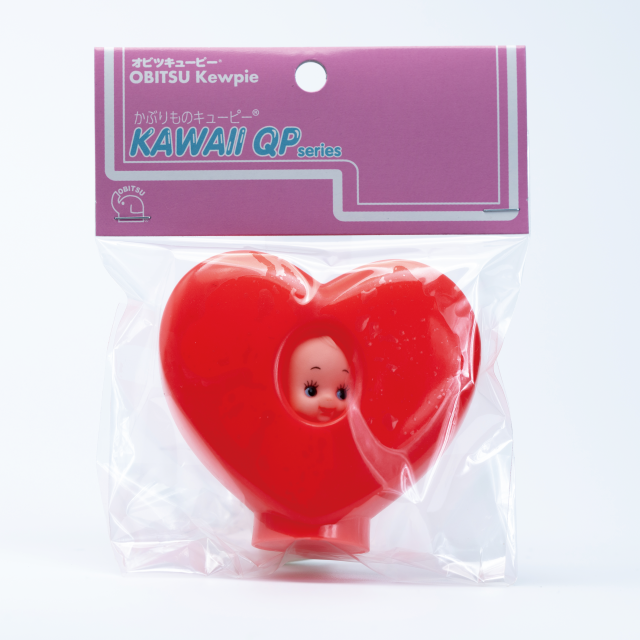 Obitsu Kewpie heart hood doll in packaging, with the Kewpie face peeking through a red heart-shaped hood.
