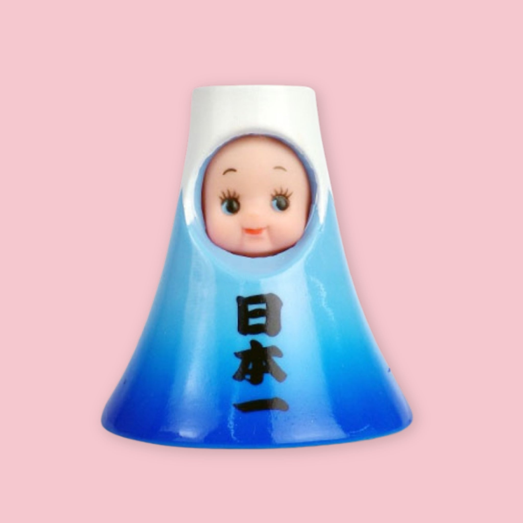 Obitsu Kewpie doll dressed as Mount Fuji, with a blue mountain-shaped hood and Japanese characters on the front.