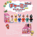 Promotional graphic for Nakayoshi Charmy Mini blind box figures, showing the retail box alongside all five colorways (Milky, Yellow, Blue, Red, Green) lined up with their Japanese labels and a black silhouette marked "Secret" for the surprise variant, plus a display carton of individual boxes and Japanese text explaining the release, with the Kodama Toy logo at the bottom.