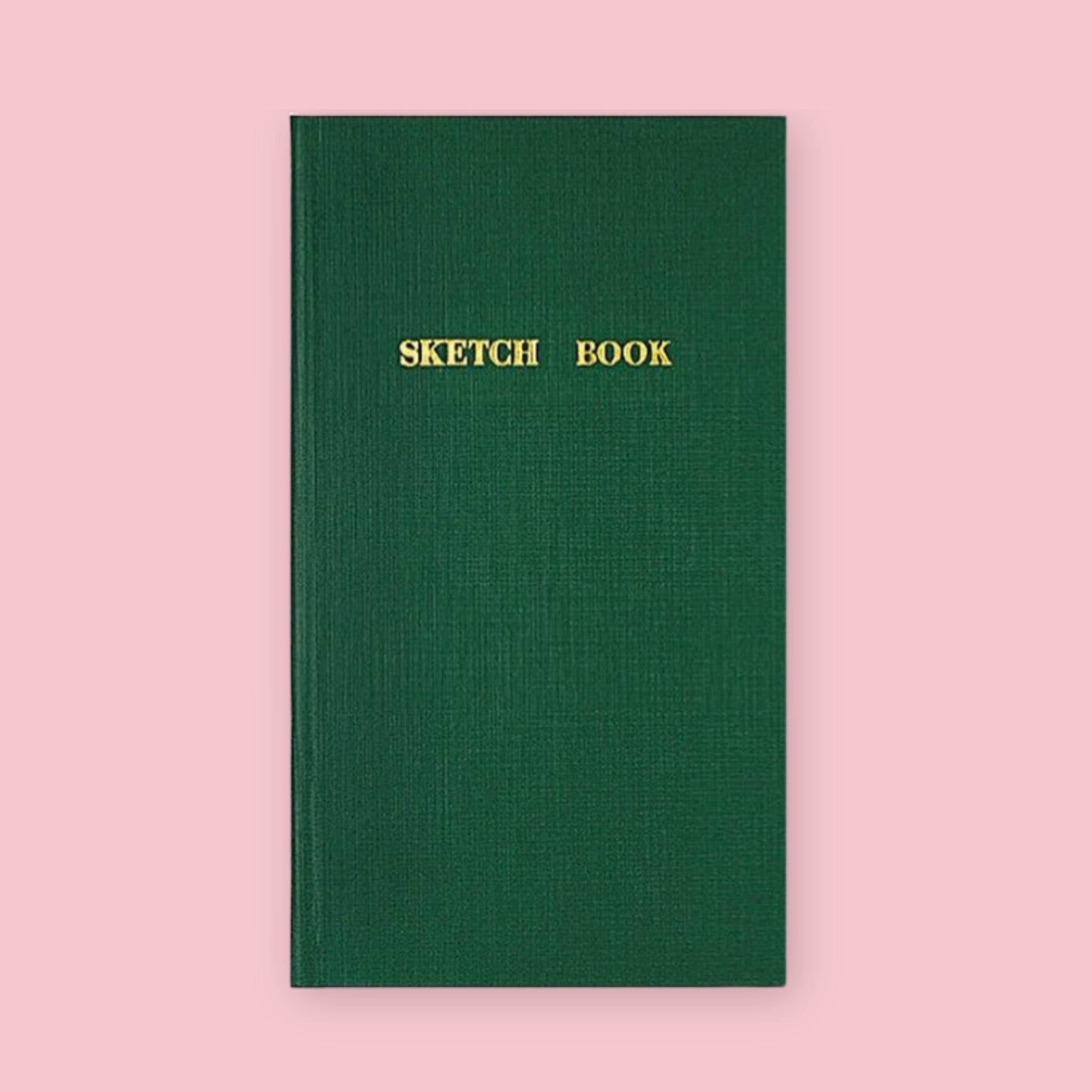 Green Kokuyo Sketch Book with gold lettering on a pink background
