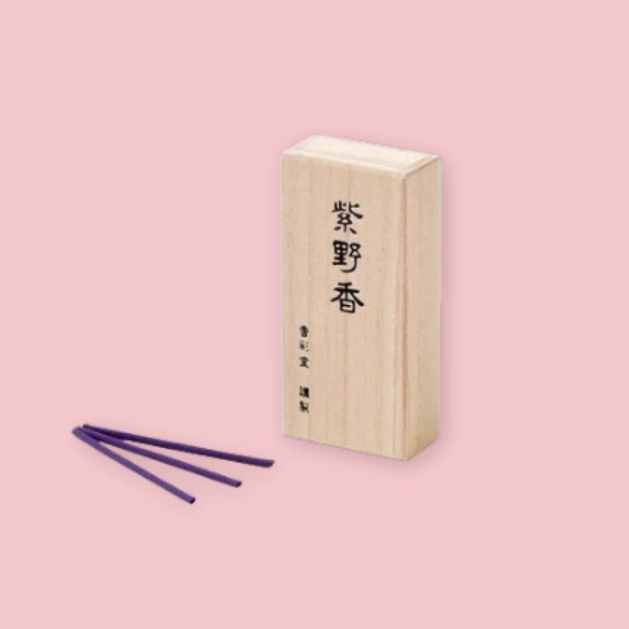 Kousaido Kyoto Dusk incense box with kanji lettering, shown beside three loose purple incense sticks, on a pink background.