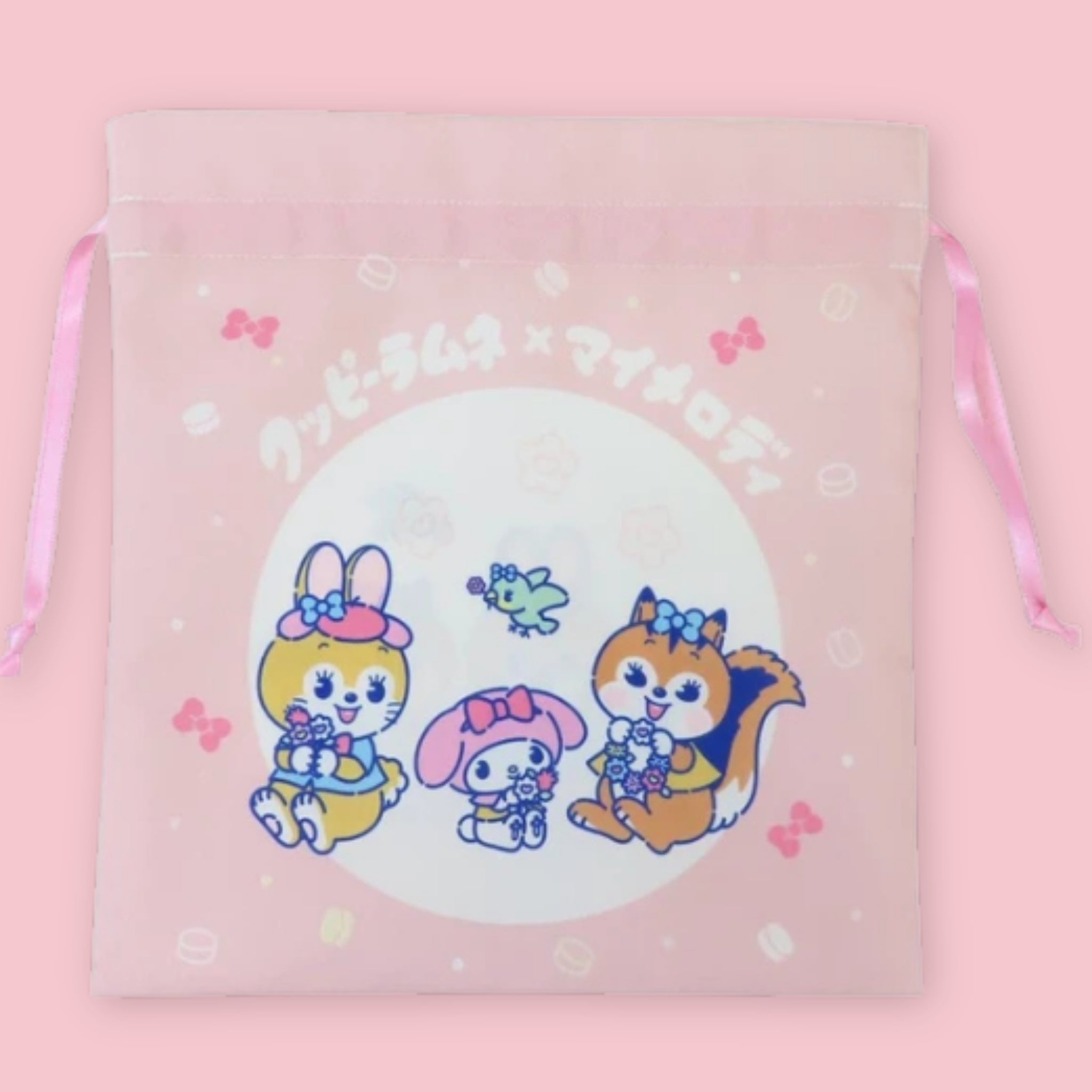 Kuppy Ramune x My Melody drawstring bag with pink ribbon closure and cartoon character artwork on pink fabric.