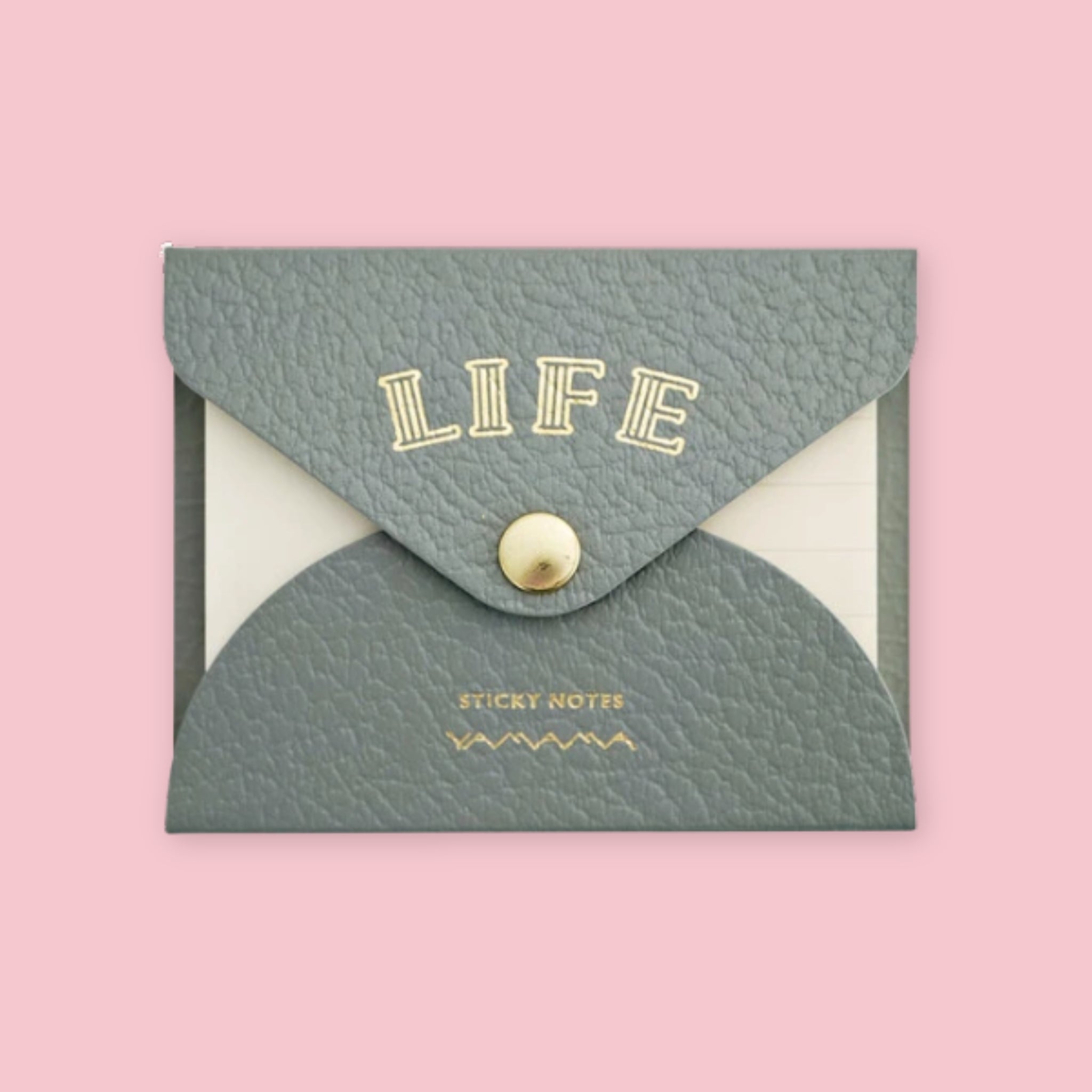 Grey faux leather envelope pouch embossed with "LIFE" sticky notes, snap closure, on a pink background.