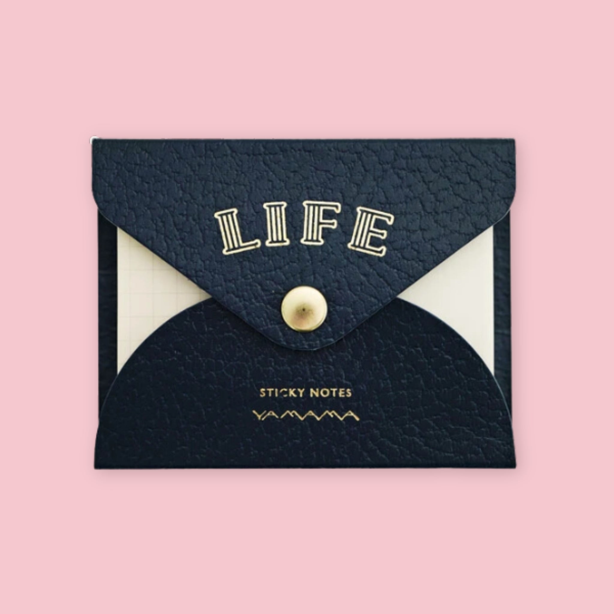 Navy blue faux leather envelope pouch embossed with "LIFE" sticky notes, snap closure, on a pink background.