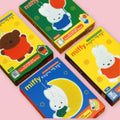 Four Miffy Diamond Painting DIY Keychain Kit boxes laid out on a pink background, showing yellow packaging with Boris the bear and Miffy designs and a blue box featuring the Miffy on the Moon design