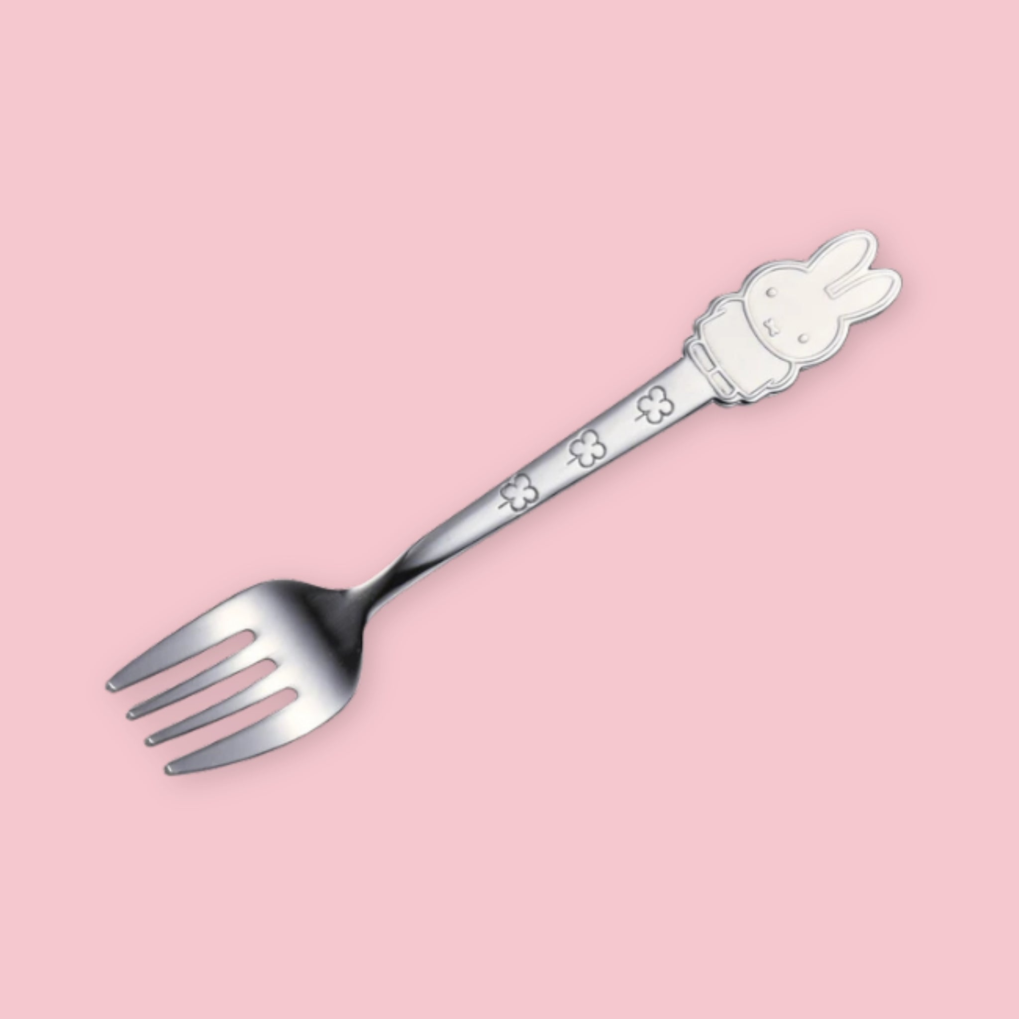 A stainless steel fork with a Miffy character handle topper and floral engraving on the stem, displayed diagonally on a pink background.