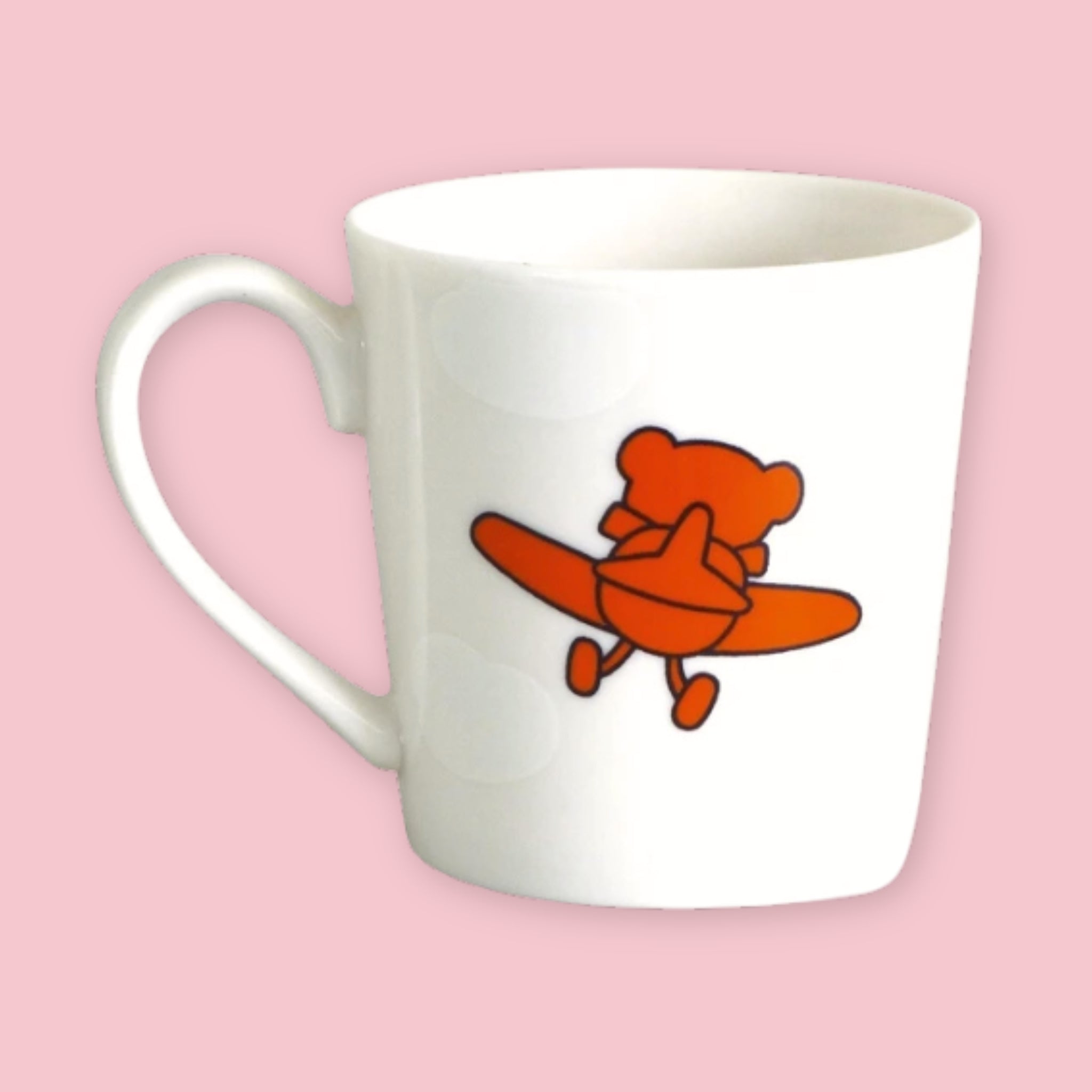 White mug printed with an illustration of Boris the bear flying an orange airplane, labeled "boris the pilot," against a pink background