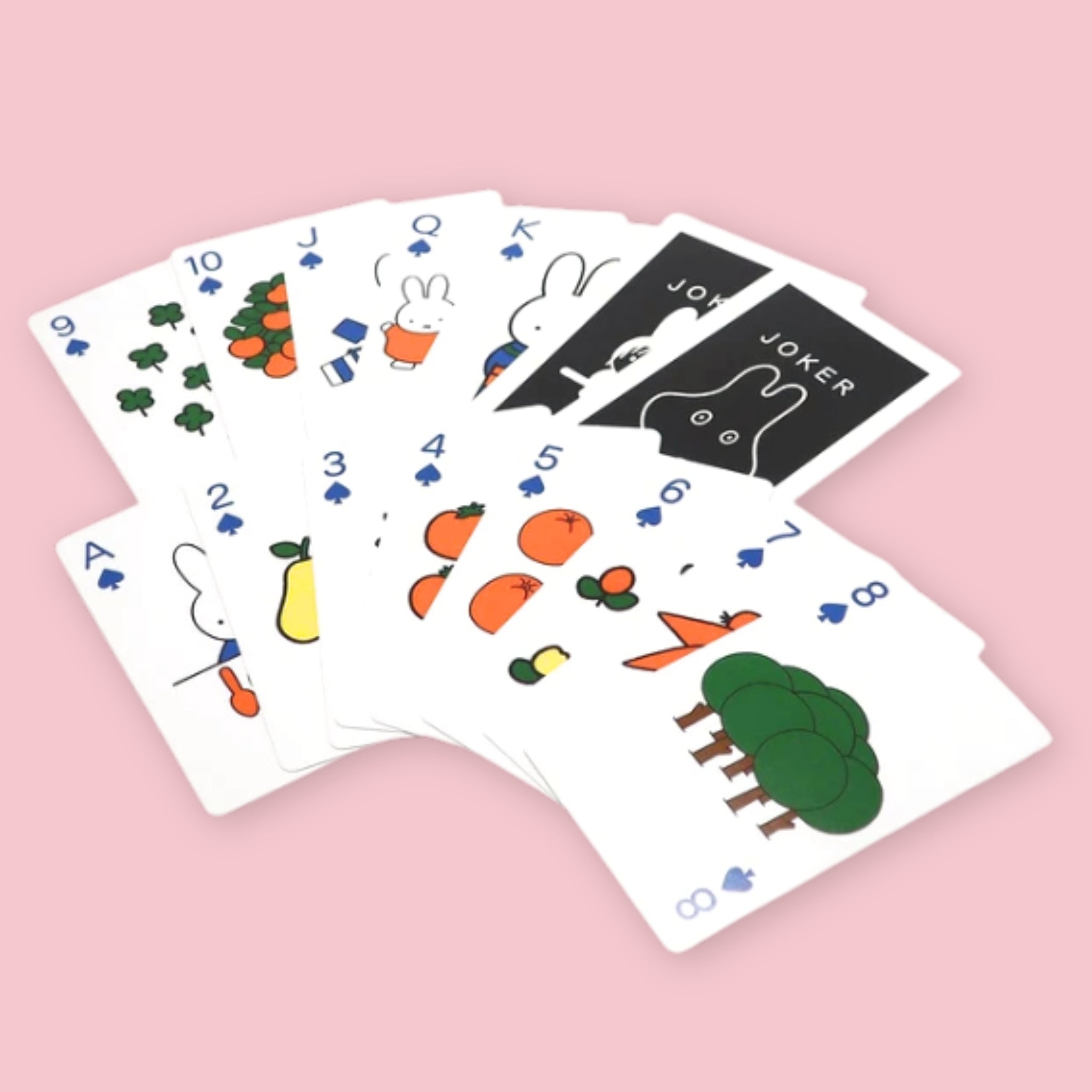 Miffy playing cards fanned out showing illustrated number and face cards with simple Miffy-style fruit, tree, and bunny graphics in a flat icon style, against a pink background