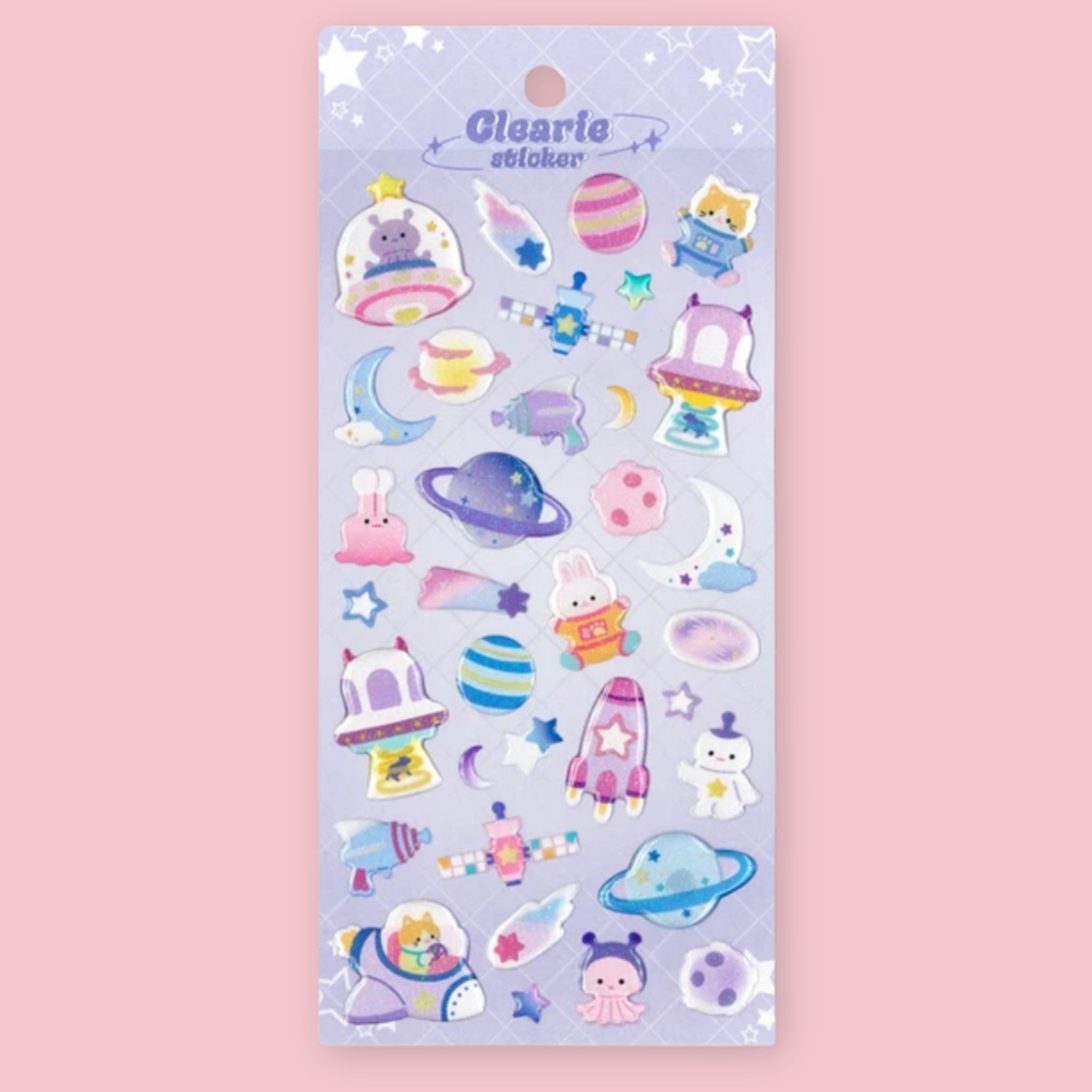 A sheet of pastel-colored stickers featuring cute space-themed illustrations, including planets, rockets, moons, stars, and small characters, on a lavender card with the brand name 'Clearie' printed at the top.