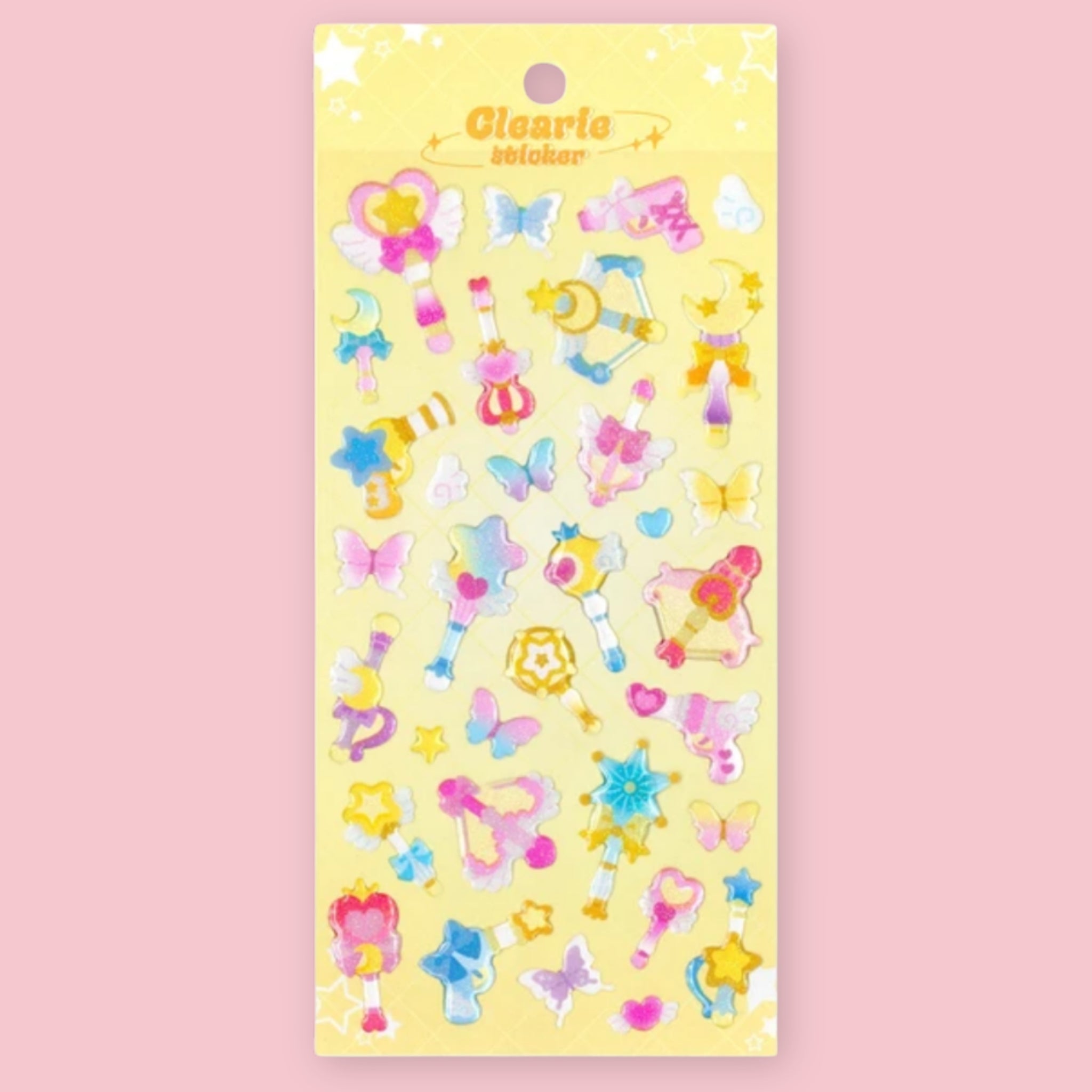 Mind Wave Clearie sticker sheet with pastel magical wand, butterfly, moon, star, and heart designs on a yellow backing card.