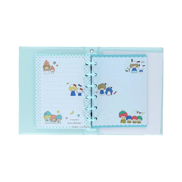 Interior of Mizutama x Sanrio sticker album with blue rings, pale blue pages, and colorful character artwork.
