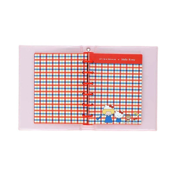 Interior of Mizutama x Hello Kitty sticker album with red rings, plaid pages, and Sanrio character artwork.