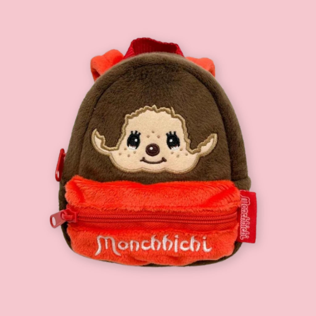 Monchhichi plush backpack pouch with brown and red fabric, embroidered face, and front zipper pocket.
