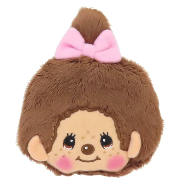 Monchhichi plush coin purse with brown fur, pink bow, smiling face, and rosy cheeks on a white background.