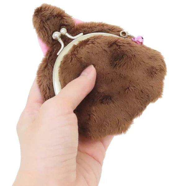 Monchhichi plush coin purse shown from the back, with brown fur, silver clasp, and pink charm on a white background.