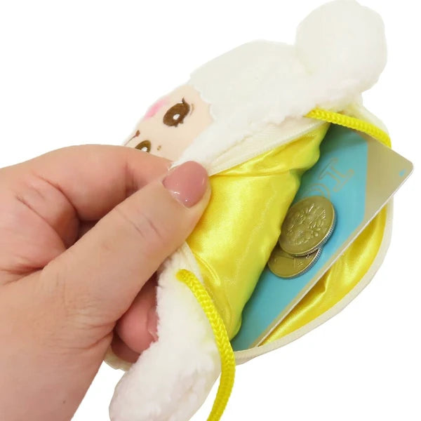 Open Monchhichi sheep neck pouch showing yellow lining, coins, and a card inside.