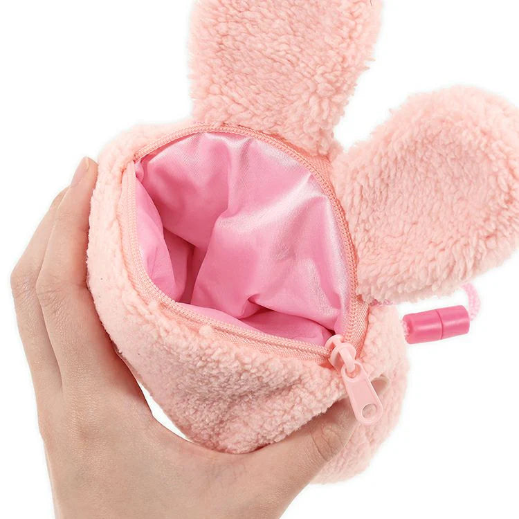 Open pink Chimutan Monchhichi plush neck pouch showing the satin-lined interior, zipper, bunny ears, and pink shoulder cord.