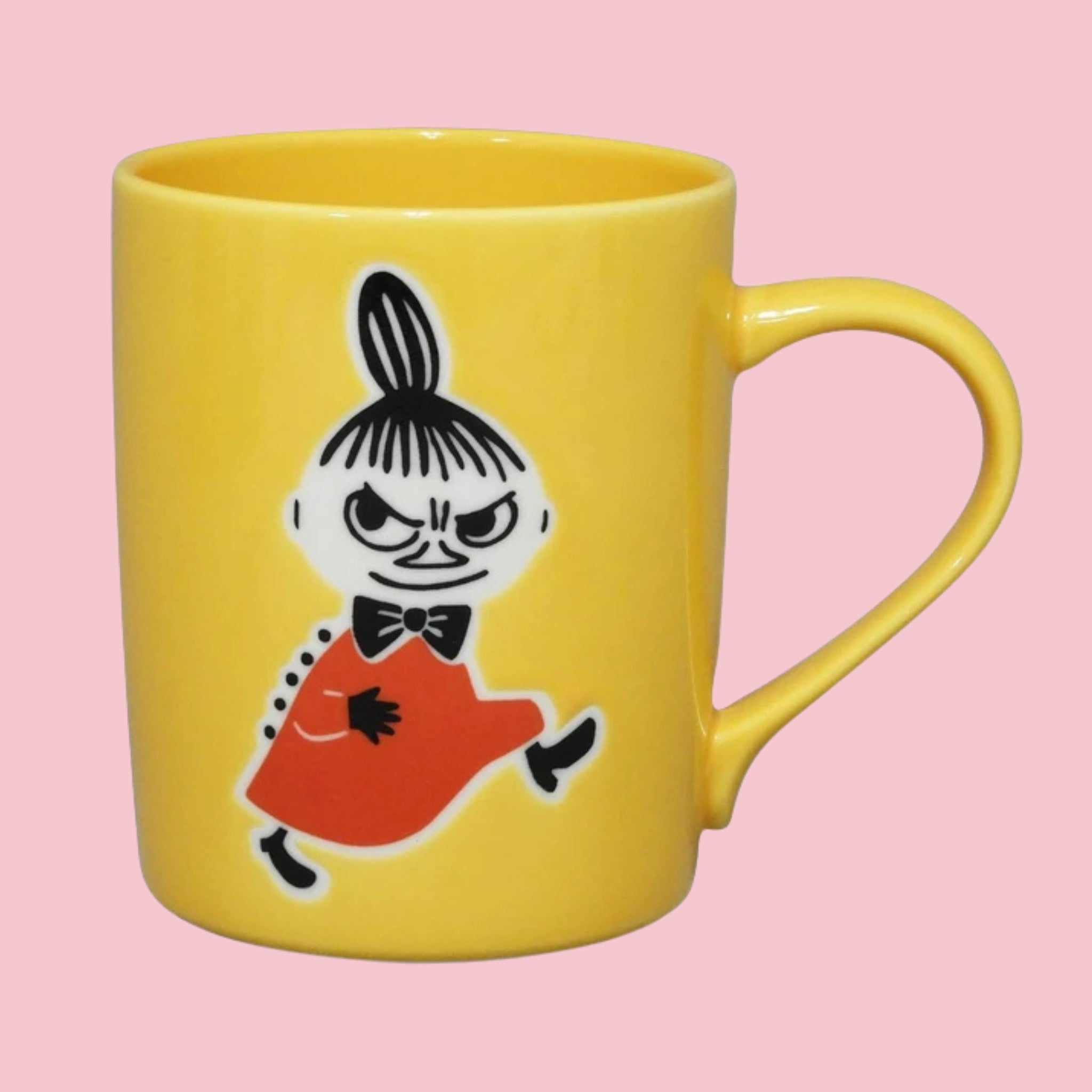 Yellow Japanese Moomin mug with an embossed Little My in her red dress and bow tie, on a pink background